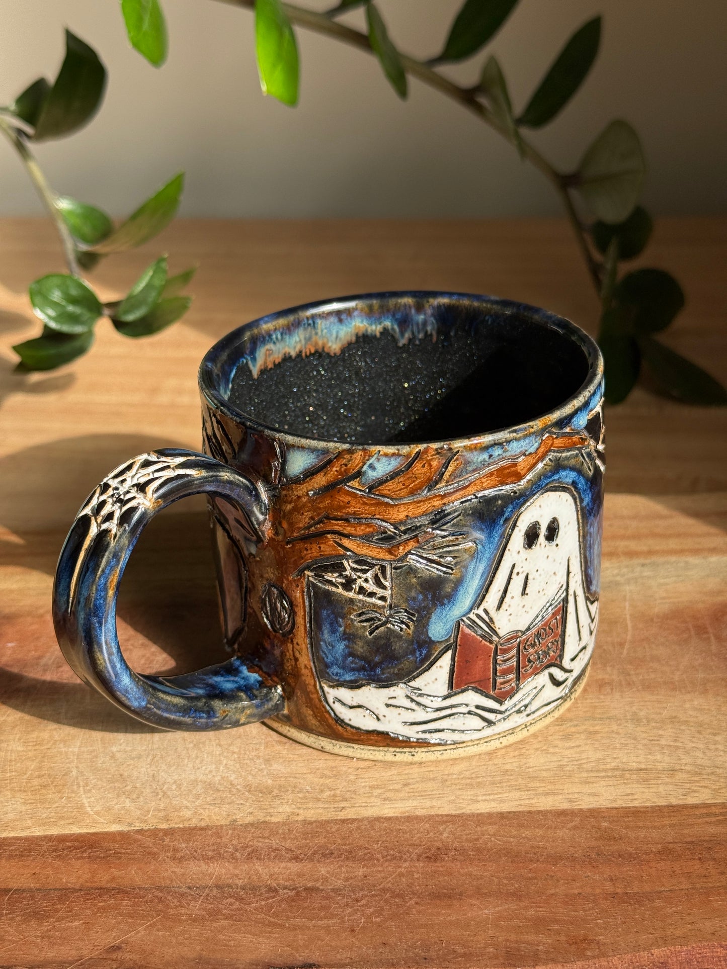 Carved Reading Ghost Mug A