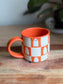 Matte Orange Checkered Ghost Mug A