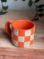 Matte Orange Checkered Ghost Mug