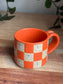 Matte Orange Checkered Ghost Mug