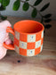 Matte Orange Checkered Ghost Mug