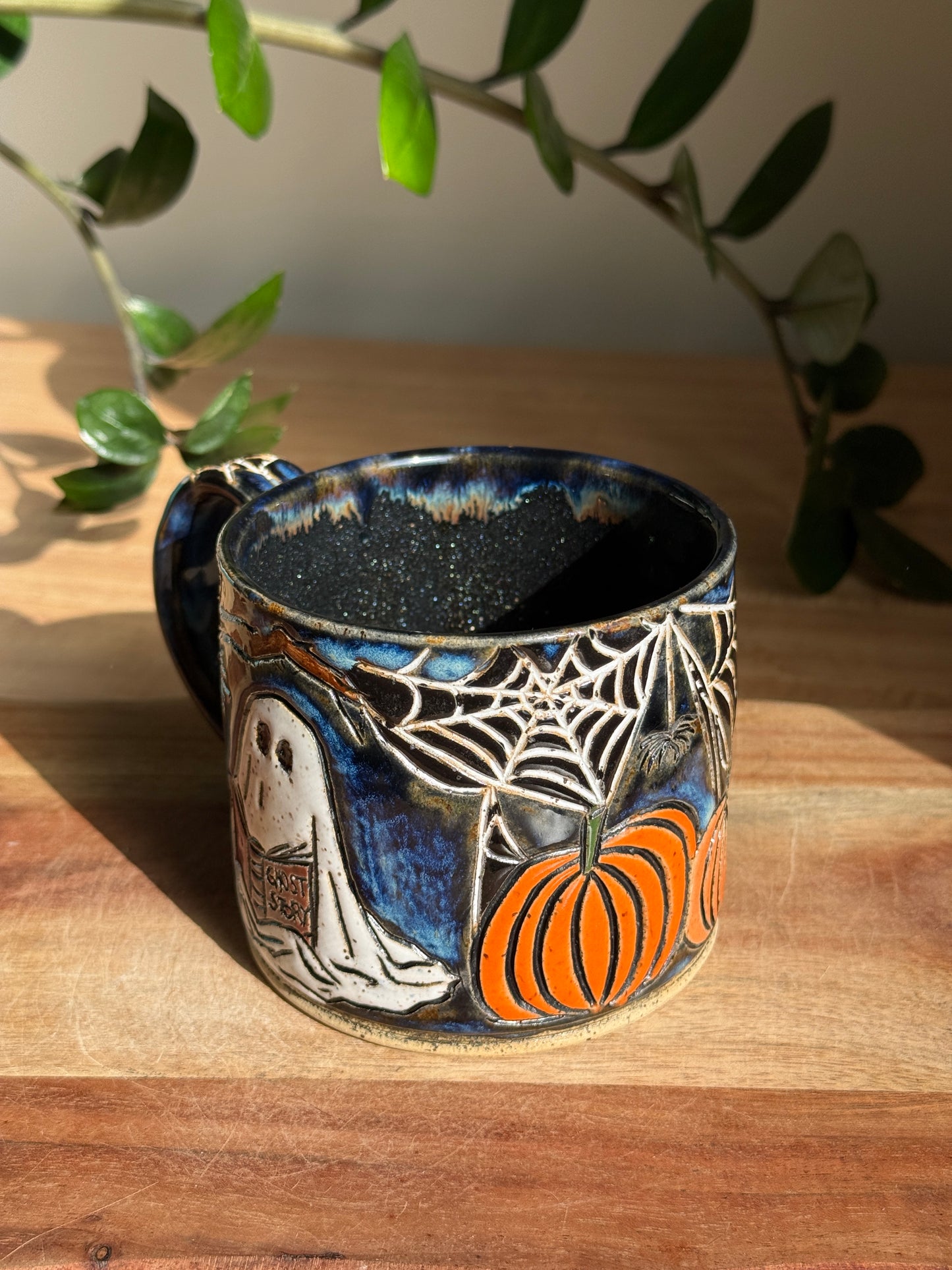 Carved Reading Ghost Mug A