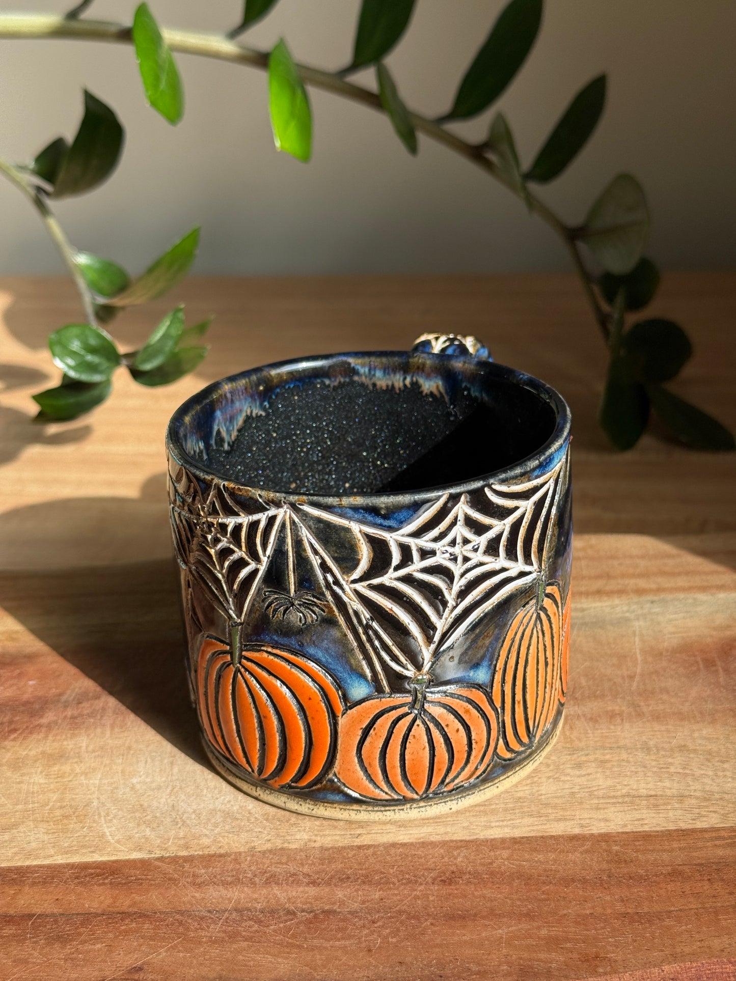 Carved Reading Ghost Mug A