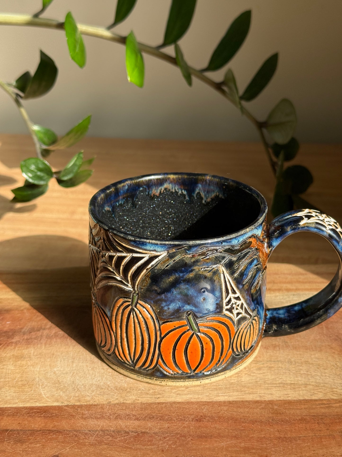 Carved Reading Ghost Mug A