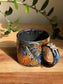 Carved Reading Ghost Mug A