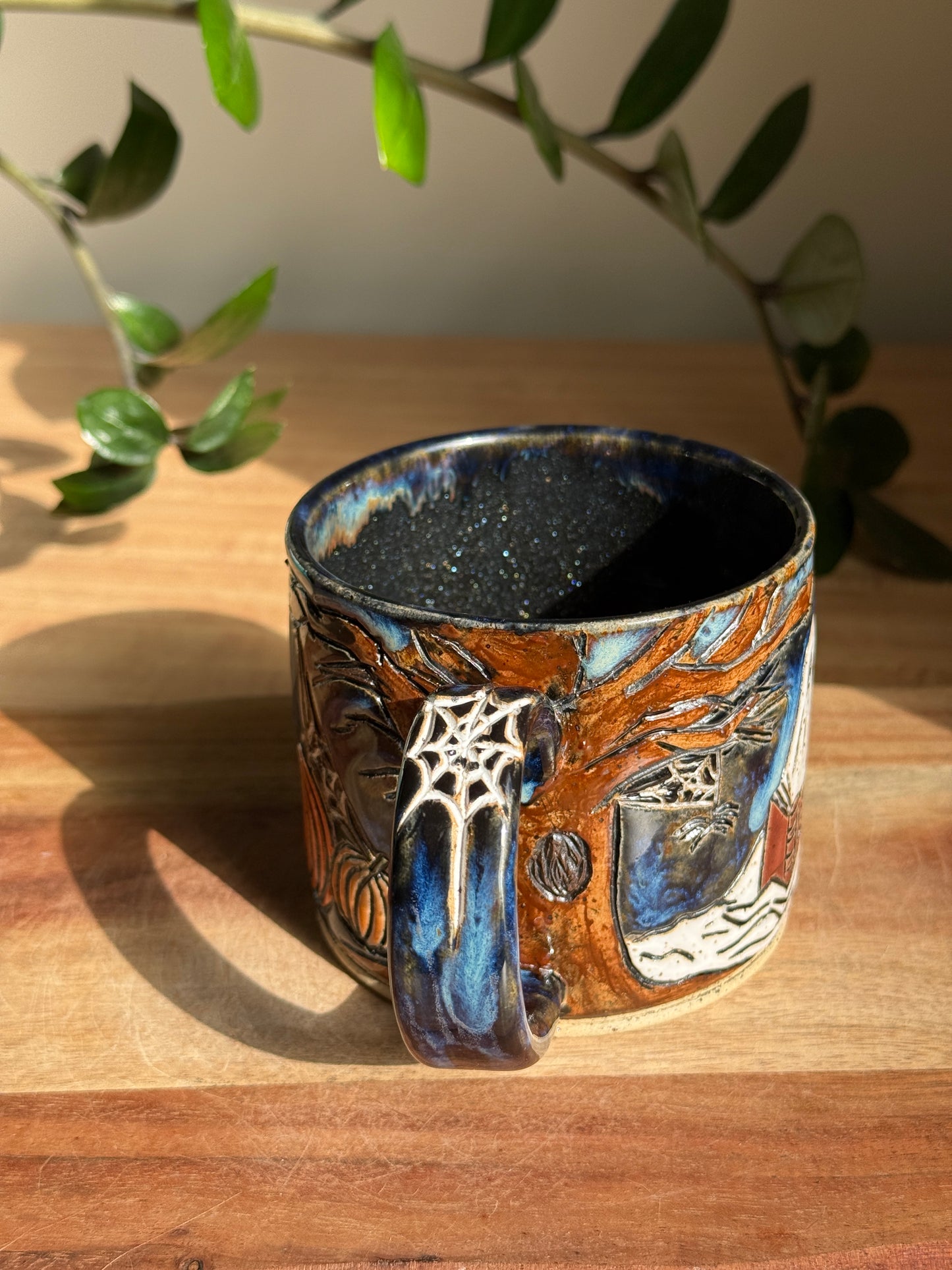 Carved Reading Ghost Mug A