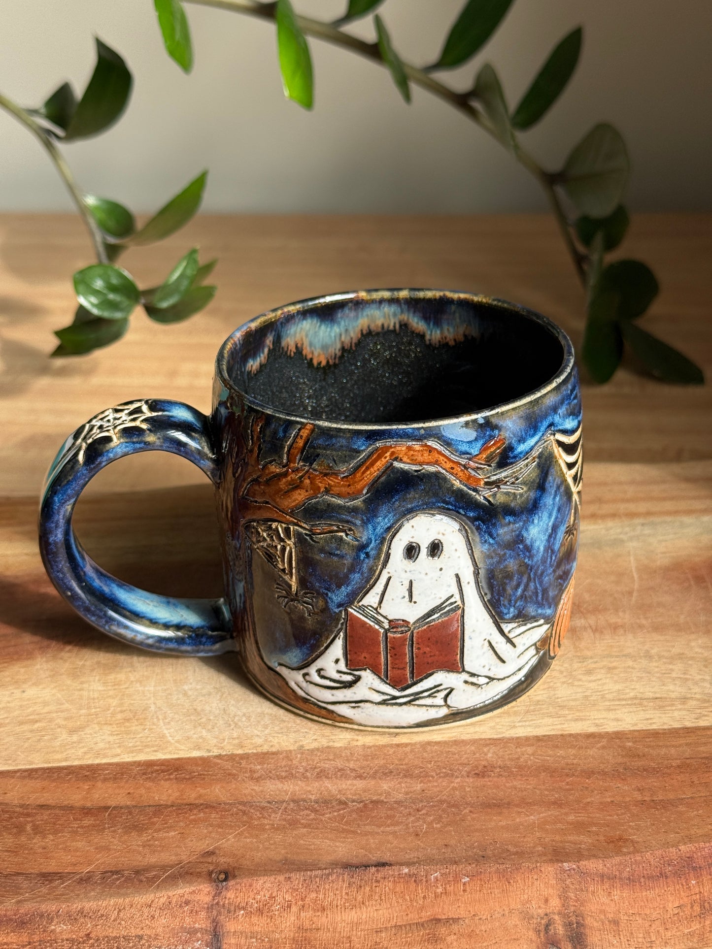 Carved Reading Ghost Mug B