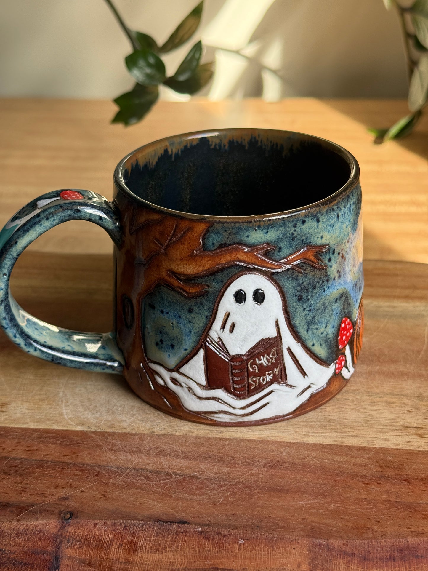 Carved Reading Ghost Mug C