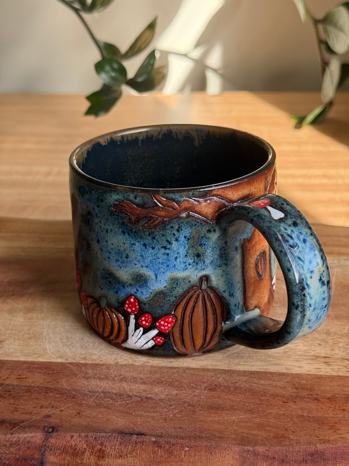 Carved Reading Ghost Mug C