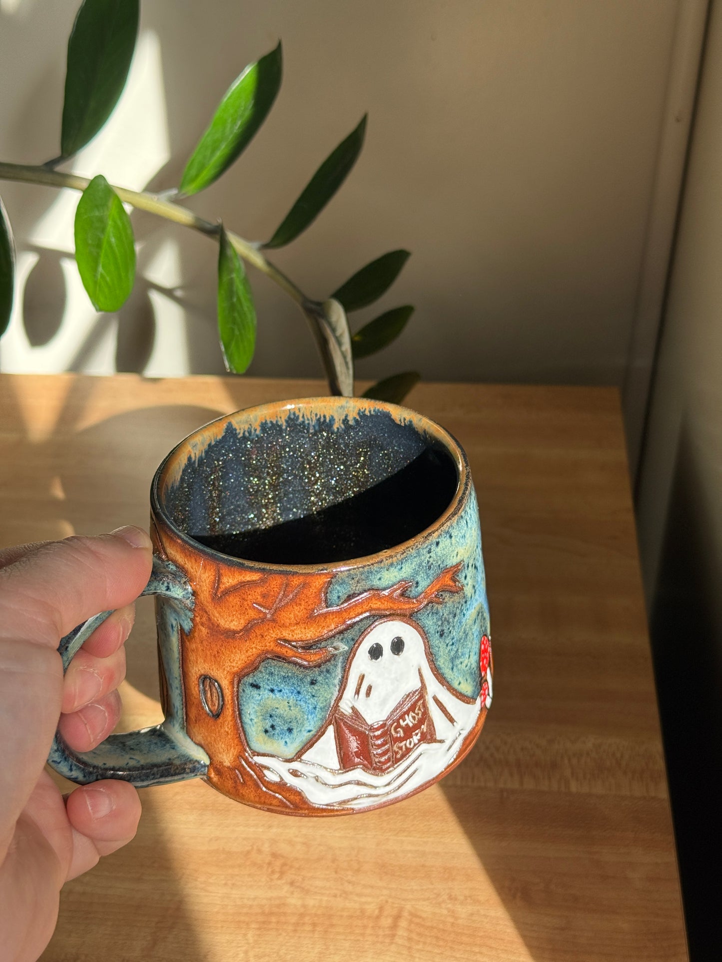 Carved Reading Ghost Mug C